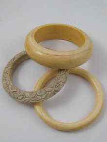 Appraisal: A mixed lot comprising three ivory bangles one of which