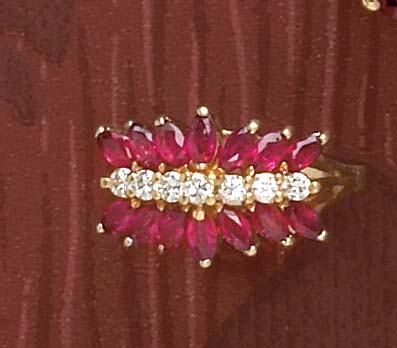 Appraisal: DIAMOND AND RUBY RING k yellow gold ring set with