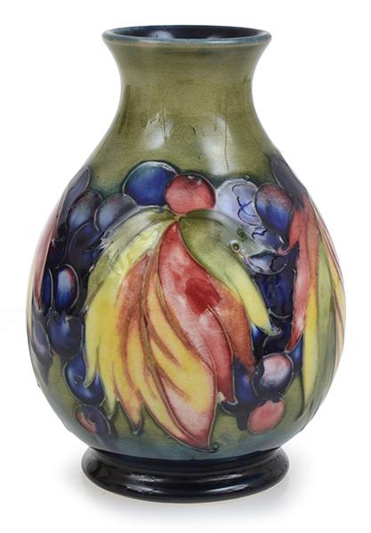 Appraisal: A WILLIAM MOORCROFT GRAPE AND LEAF VASE CIRCA impressed W