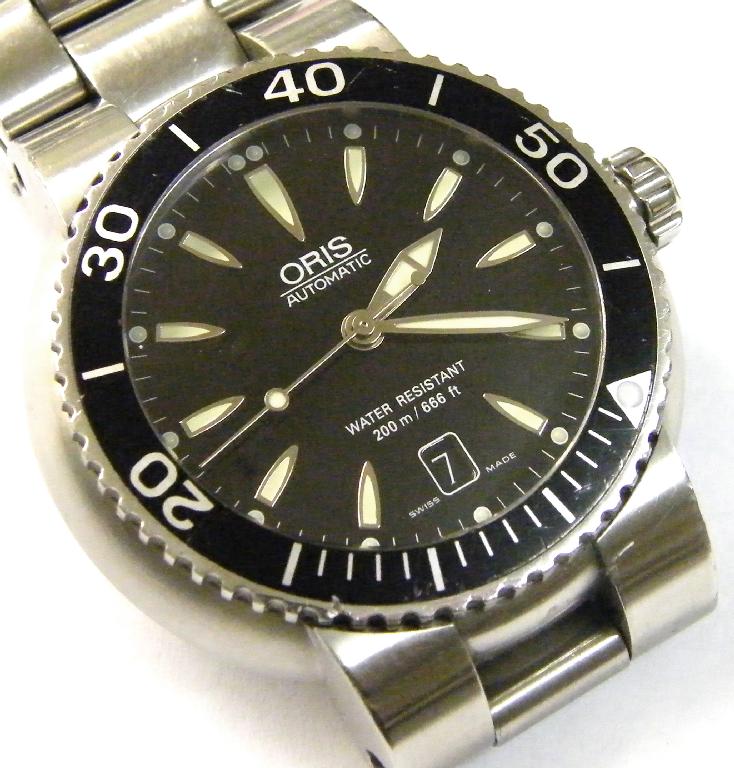 Appraisal: Oris automatic stainless steel gentleman's wristwatch with black enamel rotating