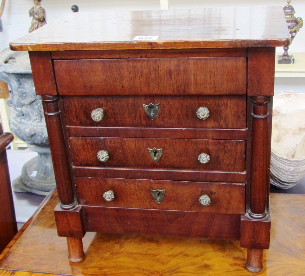 Appraisal: An early th century French mahogany miniature chest of four