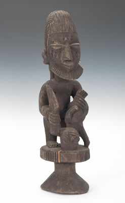 Appraisal: African Wooden Ceremonial Statue Large carved wood figure performing a