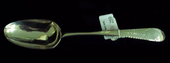 Appraisal: A George III bright cut table spoon crested Dublin