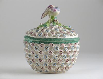 Appraisal: A rare Bow reticulated oval basket and cover applied with