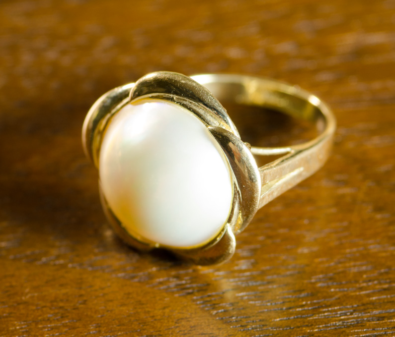 Appraisal: MABE' PEARL AND FOURTEEN KARAT GOLD RING set with a