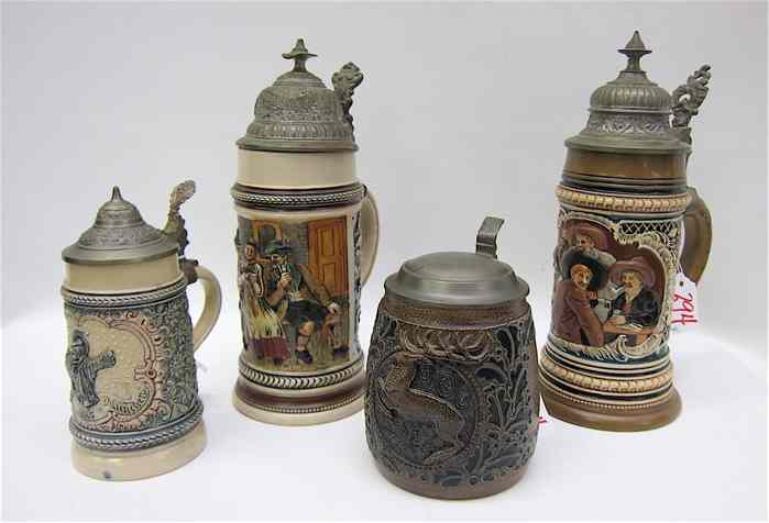 Appraisal: COLLECTION OF FOUR GERMAN POTTERY STEINS each with pewter lids