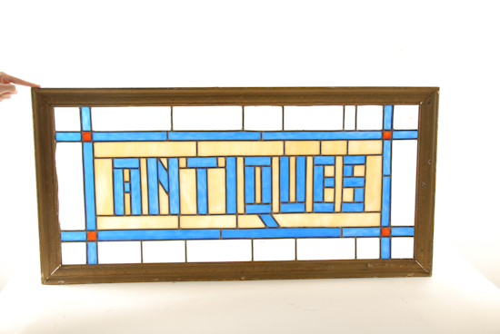 Appraisal: A Stained and Leaded Glass Window with the word Antiques