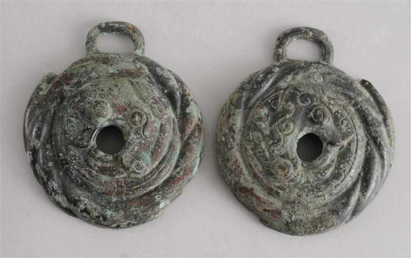 Appraisal: PAIR OF WESTERN ZHOU DYNASTY ARCHAIC BRONZE CHEEK PIECES Each