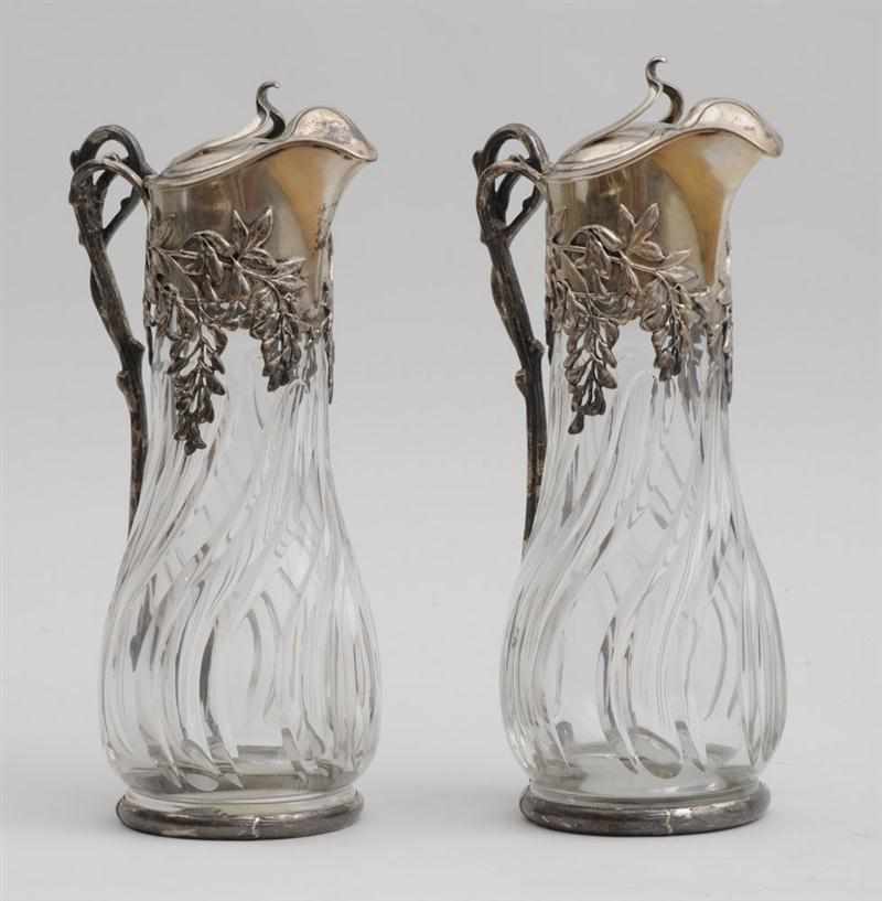 Appraisal: PAIR OF AUSTRIAN SILVER-MOUNTED CUT-GLASS WINE EWERS Each spiral reeded