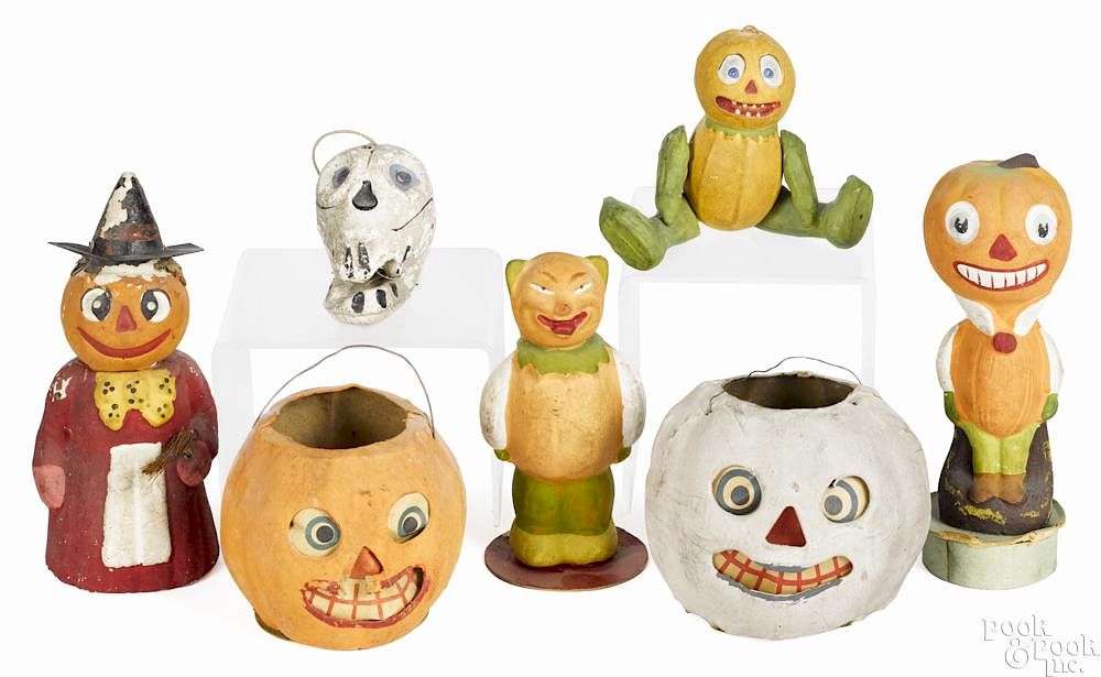 Appraisal: Seven composition Halloween candy containers mostly German to include jack-o-lanterns