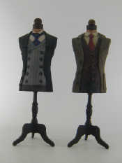 Appraisal: A pair of miniature tailor's dummies fitted with carved and