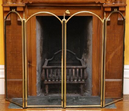 Appraisal: BRASS AND IRON-MESH FOUR-PANEL FOLDING FIREPLACE SCREEN x in