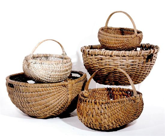 Appraisal: Five split oak baskets American three buttocks baskets having stationary