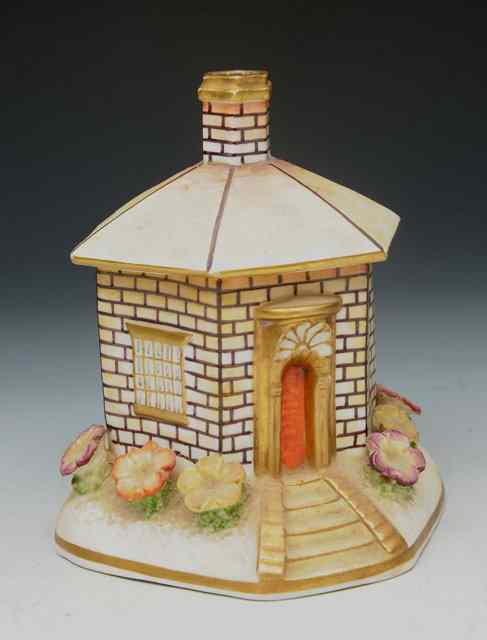 Appraisal: A SMALL STAFFORDSHIRE POTTERY COTTAGE PASTILLE BURNER together with a