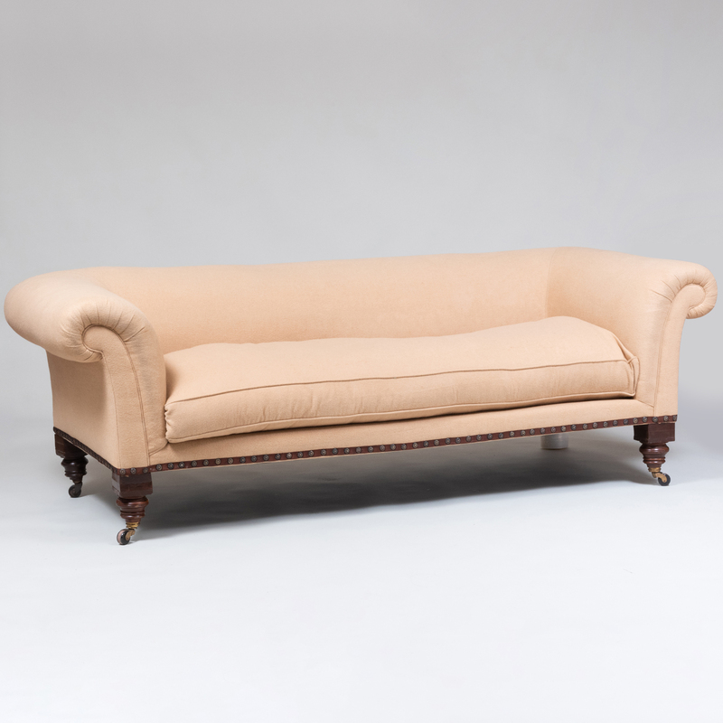 Appraisal: English Mahogany and Tan Wool Camelhair Upholstered Sofa On casters