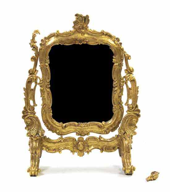 Appraisal: A Venetian Giltwood Dressing Mirror th century surmounted by a