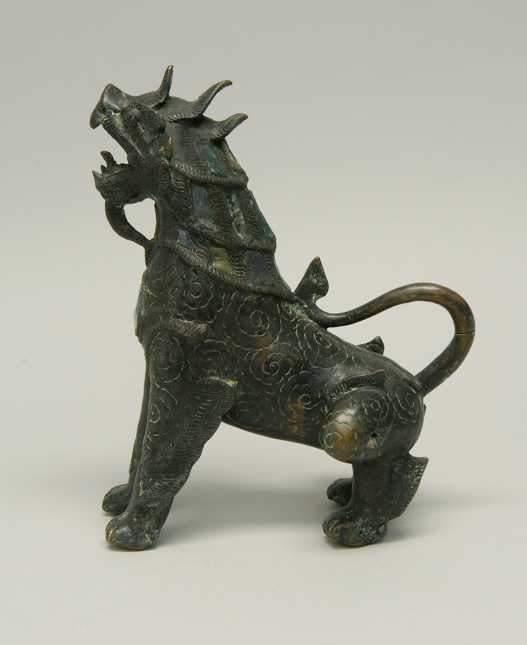 Appraisal: THAI BRONZE SEATED LION With glass inlay Height cm Length