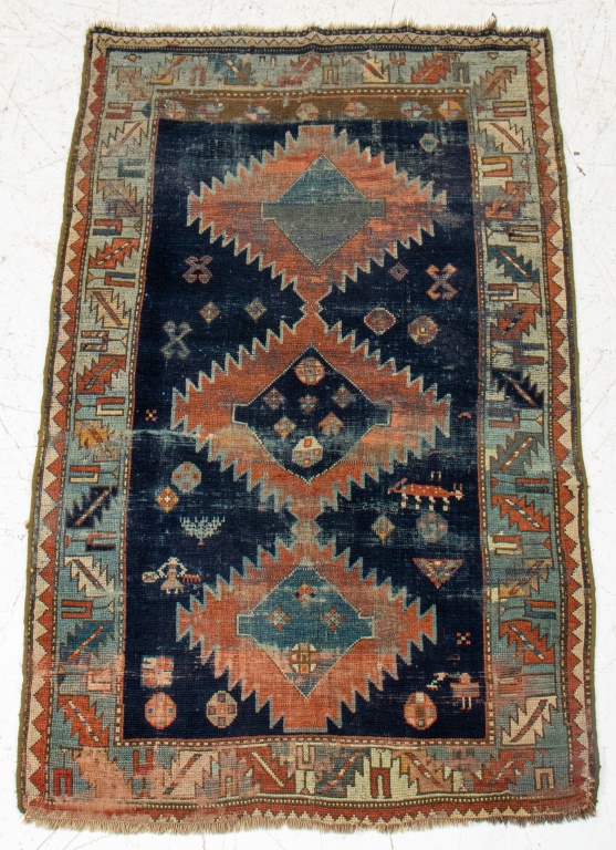 Appraisal: CAUCASIAN WOOL RUG Caucasian wool rug Previous restoration ' H