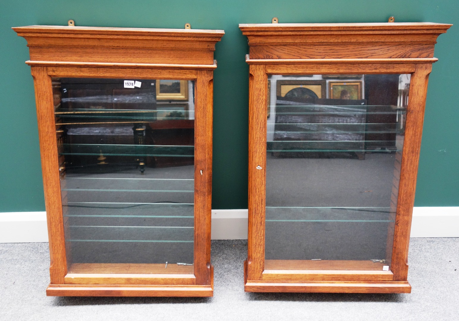 Appraisal: A pair of th century oak hanging display cupboards each