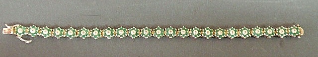 Appraisal: Ladies silver emerald and chip diamond floral motif bracelet l