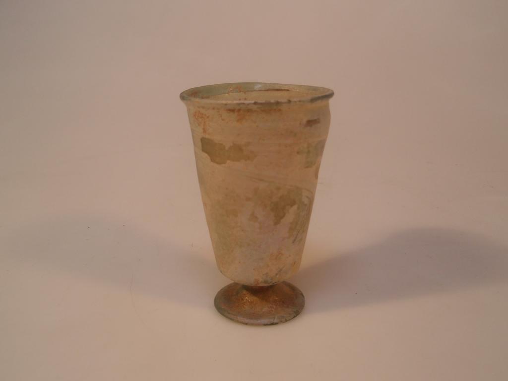 Appraisal: A Roman pale bluish-green footed glass beaker the rounded everted