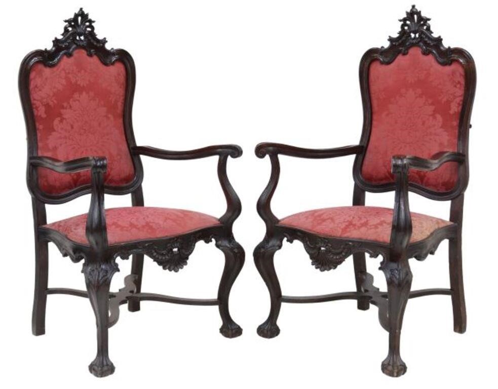 Appraisal: pair Spanish Baroque style ebonized armchairs carved shell crest over