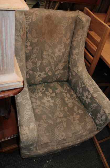 Appraisal: AN OLD WING BACK ARMCHAIR standing on square tapering egs