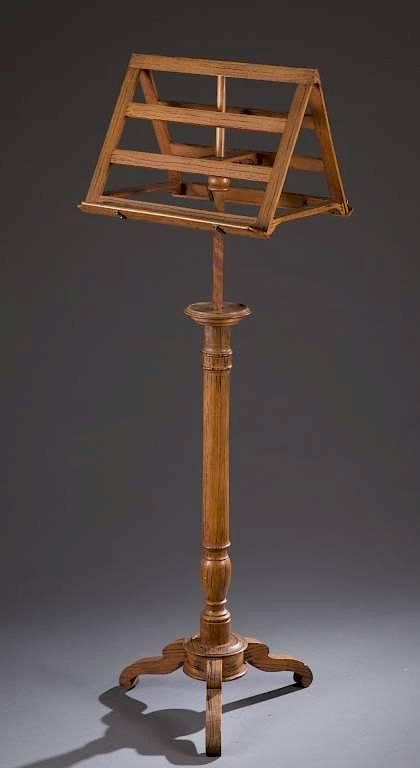 Appraisal: Carved wood music stand A carved wood double sided music