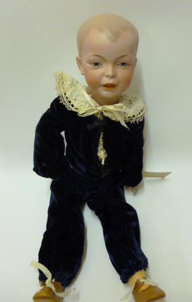 Appraisal: An SFBJ bisque head boy character doll with fixed blue