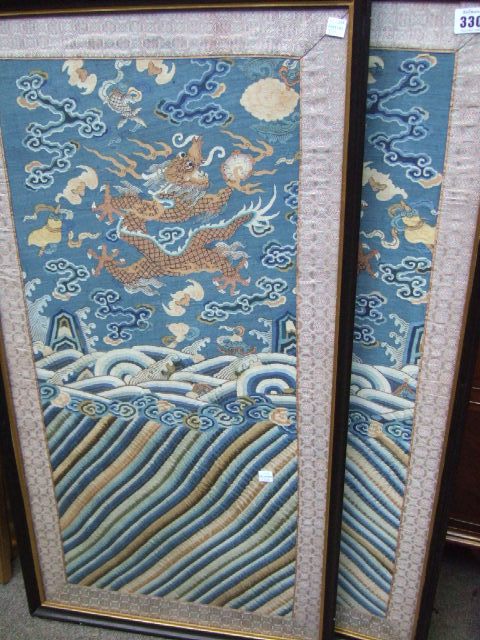 Appraisal: Two silk embroidered sleeve panels each depicting a dragon amongst