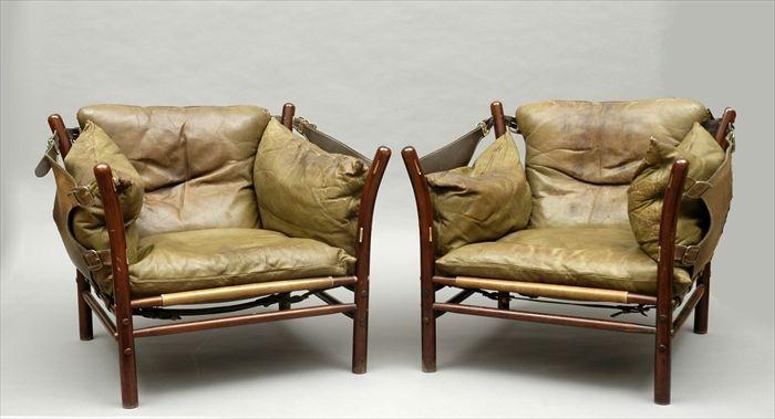 Appraisal: Arne Norell Pair of Teak Leather-Upholstered Lounge Chairs x x