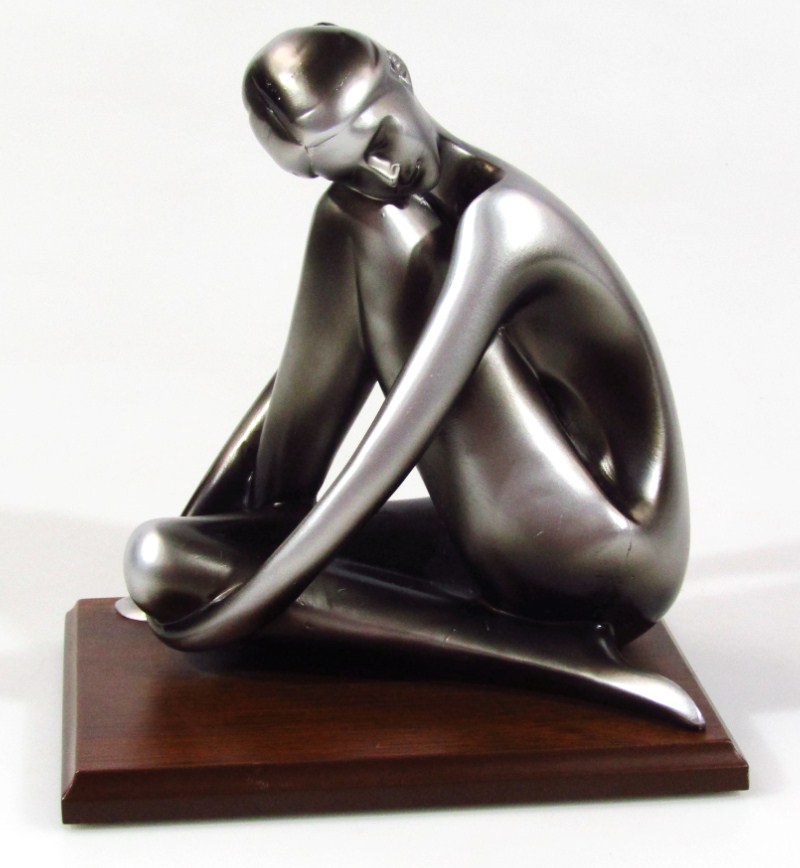 Appraisal: A modern resin figure of a nude lady with arms