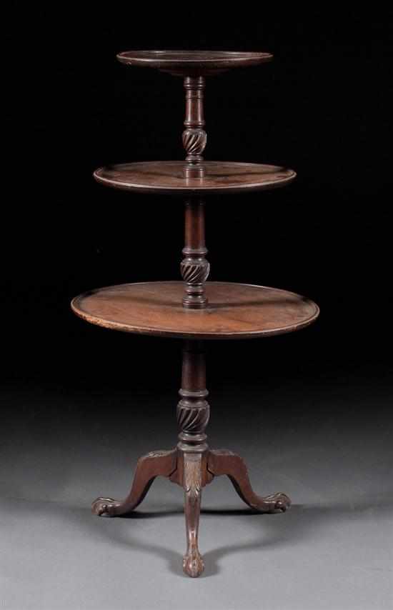 Appraisal: George III mahogany three-tier dumbwaiter urn carved columnar supports with