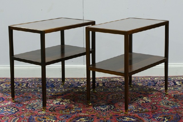 Appraisal: A pair of two tier mahogany side tables raised on