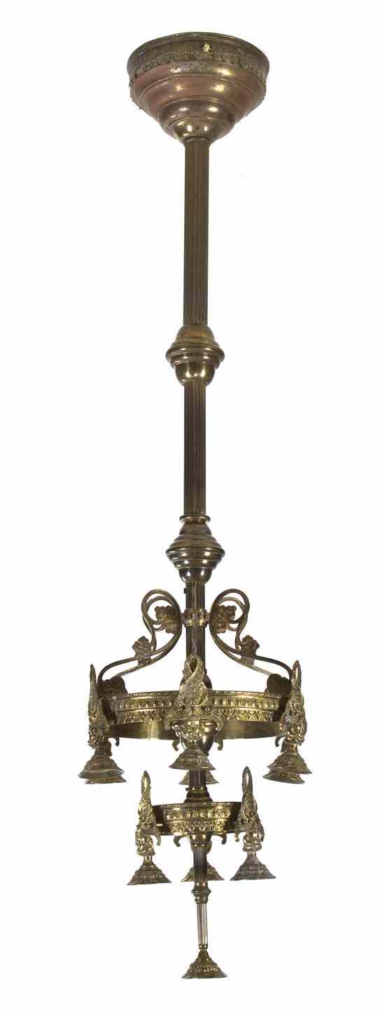 Appraisal: A Neoclassical Brass Torchieres having ten lights in three graduated