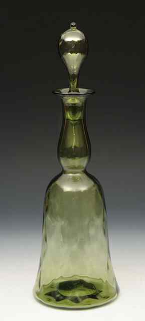 Appraisal: A green bell shaped diamond pattern glass decanter and stopper