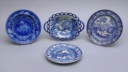 Appraisal: THREE STAFFORDSHIRE BLUE TRANSFER-PRINTED PLATES AND A RETICULATED FOOTED CAKE