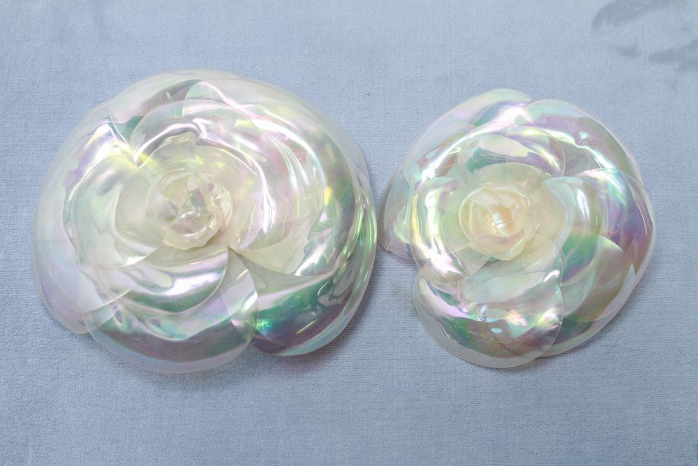 Appraisal: Chanel Vintage Camellia Vinyl Flower Brooches Two Chanel vintage iridescent