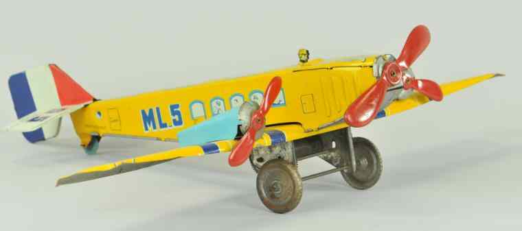 Appraisal: JML FRENCH PASSENGER AIRPLANE France lithographed tin striking yellow colors