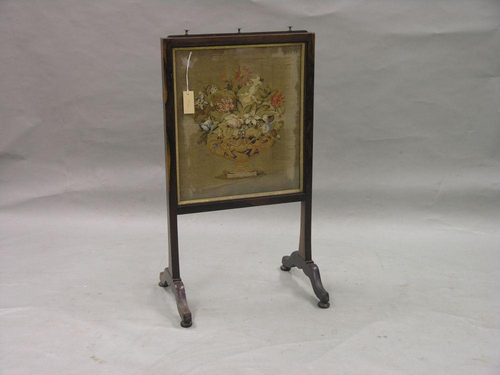 Appraisal: A Victorian rosewood firescreen inset with coloured petit point needlework