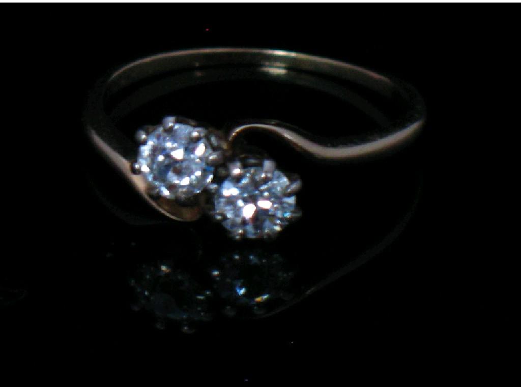 Appraisal: A TWO STONE DIAMOND RING the two round old-cut diamonds