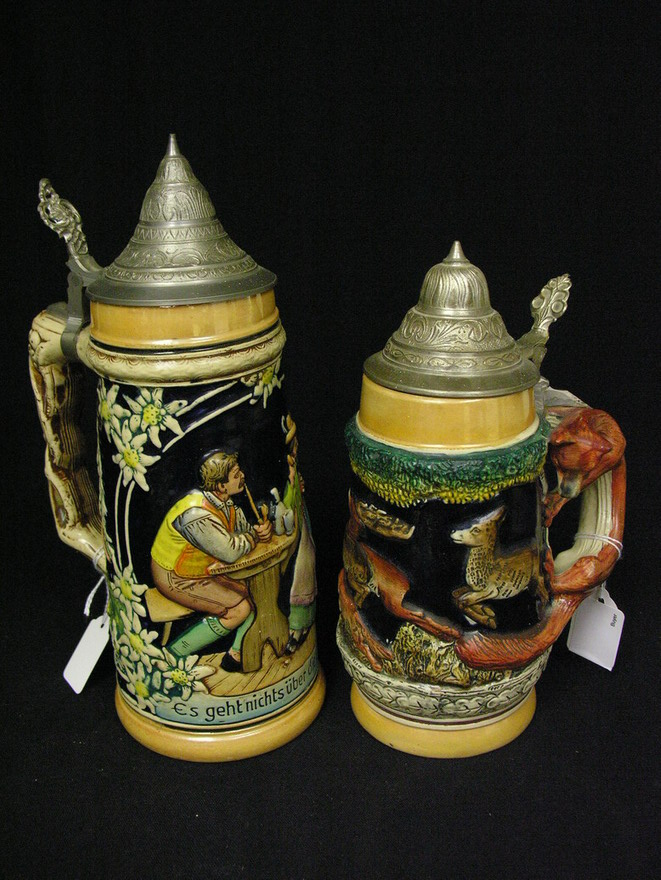 Appraisal: PAIR GERMAN STEINS Fox handle Size and