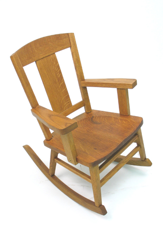 Appraisal: CHILD'S ROCKING OAK ARMCHAIR Heywood Brothers and Wakefield Co Chicago