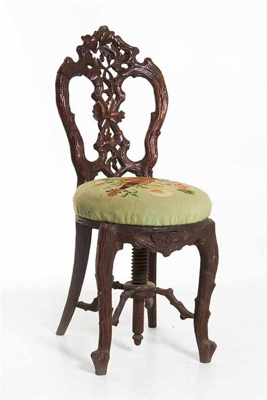 Appraisal: Black Forest carved walnut organ stool last quarter th century