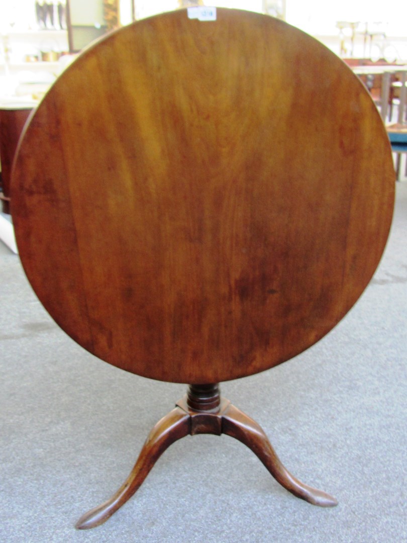 Appraisal: A th century mahogany circular snap top occasional table with