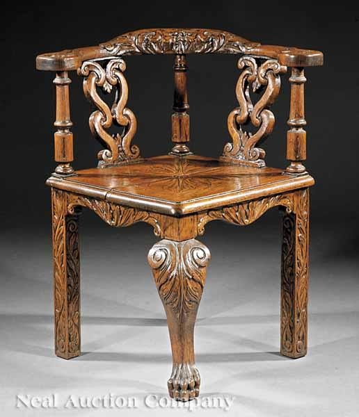 Appraisal: A Georgian-Style Carved Oak Corner Chair shaped crest rail with