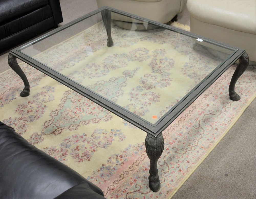 Appraisal: Glass top coffee table with iron base ht top x