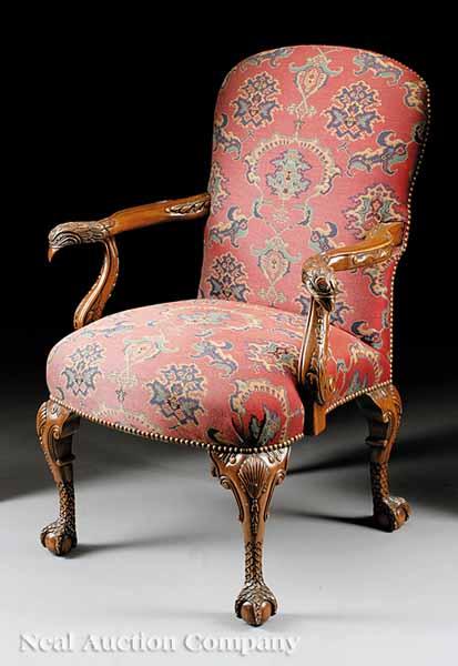 Appraisal: A Georgian-Style Carved Walnut Armchair padded back and seat serpentine