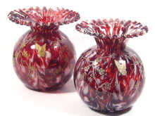 Appraisal: A pair of ruby and white carnival glass vases of