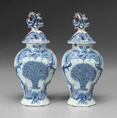 Appraisal: Pair Delft lidded jars central vase of flowers surrounded by